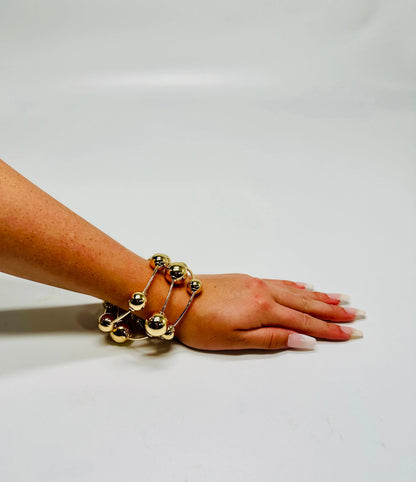 Orbital Flow Gold Cuff Bracelet with Sculptural Orbs